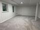 Basement with two windows, access to the upper levels, and freshly painted walls at 1102 Rogeretta Ne Dr, Atlanta, GA 30329