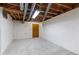 Unfinished basement features concrete block wall and access door at 1102 Rogeretta Ne Dr, Atlanta, GA 30329