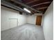 Unfinished basement space with bare ceiling, concrete walls, and doorway at 1102 Rogeretta Ne Dr, Atlanta, GA 30329