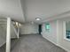 Basement featuring stairwell to the upper levels and a window that overlooks a wooded area at 1102 Rogeretta Ne Dr, Atlanta, GA 30329