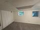 Basement featuring storage closets and a window overlooking a wooded area at 1102 Rogeretta Ne Dr, Atlanta, GA 30329