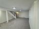 Basement featuring stairwell to the upper levels and storage at 1102 Rogeretta Ne Dr, Atlanta, GA 30329