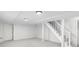Finished basement with a staircase, white walls, and neutral carpet. Ready for customization at 1102 Rogeretta Ne Dr, Atlanta, GA 30329