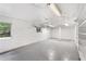 Spacious basement features painted walls, concrete floor, storage shelving, and a window to the outside at 1102 Rogeretta Ne Dr, Atlanta, GA 30329