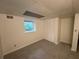 Neutral carpeted bedroom featuring a window for natural light and closet for storage at 1102 Rogeretta Ne Dr, Atlanta, GA 30329