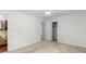 A bright bedroom featuring neutral decor with an open closet and a connecting bathroom entrance at 1102 Rogeretta Ne Dr, Atlanta, GA 30329