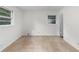 Well-lit bedroom featuring neutral walls, carpet, and two windows bringing in ample natural light at 1102 Rogeretta Ne Dr, Atlanta, GA 30329