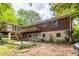Backyard exterior featuring a two-story home with a wooden deck, perfect for outdoor entertaining at 1102 Rogeretta Ne Dr, Atlanta, GA 30329