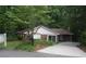 Charming brick home with a well-manicured front yard and an inviting entrance at 1102 Rogeretta Ne Dr, Atlanta, GA 30329