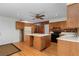View of kitchen with oak cabinets, central island and black gas range at 1102 Rogeretta Ne Dr, Atlanta, GA 30329