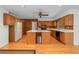 Spacious kitchen with light oak cabinets, island and wood flooring at 1102 Rogeretta Ne Dr, Atlanta, GA 30329
