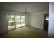 Open-concept living room with access to the outside deck through sliding glass doors at 1102 Rogeretta Ne Dr, Atlanta, GA 30329