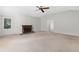 Large living room with brick fireplace, carpeted floor and large windows at 1102 Rogeretta Ne Dr, Atlanta, GA 30329