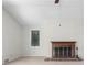 Bright living room featuring a fireplace and window bringing in lots of natural light at 1102 Rogeretta Ne Dr, Atlanta, GA 30329