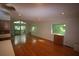Open-concept living room featuring hardwood floors, natural light, and access to the outdoor deck at 1102 Rogeretta Ne Dr, Atlanta, GA 30329