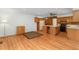 Living room and kitchen area featuring hardwood floors, neutral walls, and wooden cabinets at 1102 Rogeretta Ne Dr, Atlanta, GA 30329