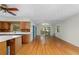 Open-concept living area with hardwood floors and natural light from large windows at 1102 Rogeretta Ne Dr, Atlanta, GA 30329