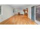 Bright living room with hardwood floors flows into kitchen with oak cabinets and white appliances at 1102 Rogeretta Ne Dr, Atlanta, GA 30329
