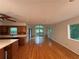 Open-concept living room featuring hardwood floors, natural light, and access to the outdoor deck at 1102 Rogeretta Ne Dr, Atlanta, GA 30329