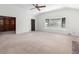 Spacious living room offers a bright window with a view of the yard and built-in shelves at 1102 Rogeretta Ne Dr, Atlanta, GA 30329