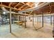 Large unfinished basement area with shelving, support beams, and plenty of room for storage or customization at 2233 Clairmont Ne Rd, Atlanta, GA 30329
