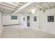Finished basement area with white walls, carpeted floors, and a window for natural light, perfect for recreation at 2233 Clairmont Ne Rd, Atlanta, GA 30329