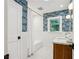 Stylish bathroom featuring subway tile walls, patterned wallpaper, and a shower-tub combination at 2233 Clairmont Ne Rd, Atlanta, GA 30329