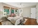 Serene bedroom featuring hardwood floors, natural window coverings, and soft lighting at 2233 Clairmont Ne Rd, Atlanta, GA 30329