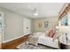 Cozy bedroom with a ceiling fan, stylish rug, and a well-decorated bed with plush pillows and a blanket at 2233 Clairmont Ne Rd, Atlanta, GA 30329