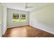 Inviting bedroom with hardwood floors, a ceiling fan, and a large window at 2233 Clairmont Ne Rd, Atlanta, GA 30329
