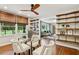 Cozy dining area with a glass table, stylish chairs, and custom wooden shelving at 2233 Clairmont Ne Rd, Atlanta, GA 30329