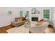 Comfortable living room with fireplace, ample natural light, and stylish decor at 2233 Clairmont Ne Rd, Atlanta, GA 30329