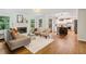 Open concept living area flows into kitchen, with hardwood floors and a cozy fireplace at 2233 Clairmont Ne Rd, Atlanta, GA 30329