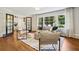 Bright living room featuring hardwood floors, large windows, and stylish furnishings at 2233 Clairmont Ne Rd, Atlanta, GA 30329