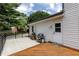 Wood deck with barbecue and fence overlooking green lawn at 4047 Dunwoody Club Dr, Dunwoody, GA 30350