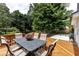 Outdoor wooden deck featuring table and chairs for dining al fresco at 4047 Dunwoody Club Dr, Dunwoody, GA 30350