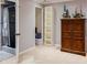 Basement with adjacent bathroom, wooden cabinet, and decorative toys at 4047 Dunwoody Club Dr, Dunwoody, GA 30350