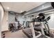 Finished basement featuring exercise equipment and mirrored walls at 4047 Dunwoody Club Dr, Dunwoody, GA 30350