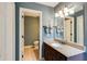 Bathroom showcasing a granite countertop, modern sink, and a view into an adjacent toilet room at 4047 Dunwoody Club Dr, Dunwoody, GA 30350