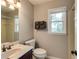 A bathroom features neutral walls, granite countertops, and modern fixtures at 4047 Dunwoody Club Dr, Dunwoody, GA 30350