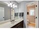 A bathroom features a large mirror, granite countertops, and a modern sink at 4047 Dunwoody Club Dr, Dunwoody, GA 30350