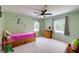 A delightful bedroom features a unicorn wall decal, neutral walls, and a ceiling fan at 4047 Dunwoody Club Dr, Dunwoody, GA 30350