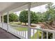 Inviting front porch with lush landscaping and views of the surrounding neighborhood at 4047 Dunwoody Club Dr, Dunwoody, GA 30350