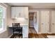 Modern eat-in kitchen features a built-in desk, granite countertops, and stainless steel appliances at 4047 Dunwoody Club Dr, Dunwoody, GA 30350