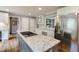Updated kitchen features stainless steel appliances, island cooktop, granite countertops and wood flooring at 4047 Dunwoody Club Dr, Dunwoody, GA 30350