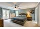 Well-lit main bedroom featuring a ceiling fan, ensuite bathroom and private outdoor access at 4047 Dunwoody Club Dr, Dunwoody, GA 30350