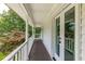 A long porch, painted white, with brown wooden floors at 4047 Dunwoody Club Dr, Dunwoody, GA 30350