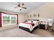 Bright bedroom with large window, plush carpet, and decorative touches for a serene atmosphere at 4455 Orchard Lake Dr, Cumming, GA 30028