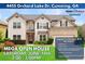 Charming two-story home featuring a combination of siding and brick, with a manicured front yard and inviting curb appeal at 4455 Orchard Lake Dr, Cumming, GA 30028