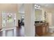 Foyer with hardwood floors and adjacent half-bathroom with granite countertops and modern fixtures at 4455 Orchard Lake Dr, Cumming, GA 30028